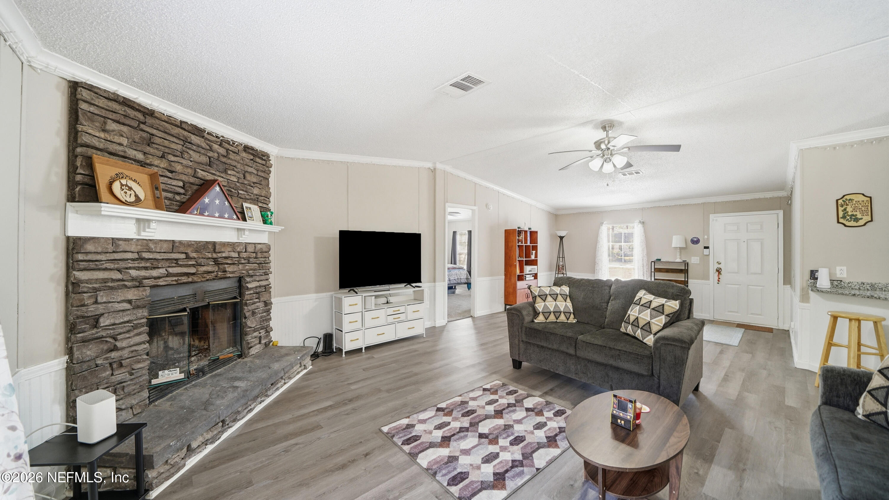 85324 Lil William Road Fernandina Beach, FL 32034 - Photo 3 of 36 a living room with furniture and a fireplace