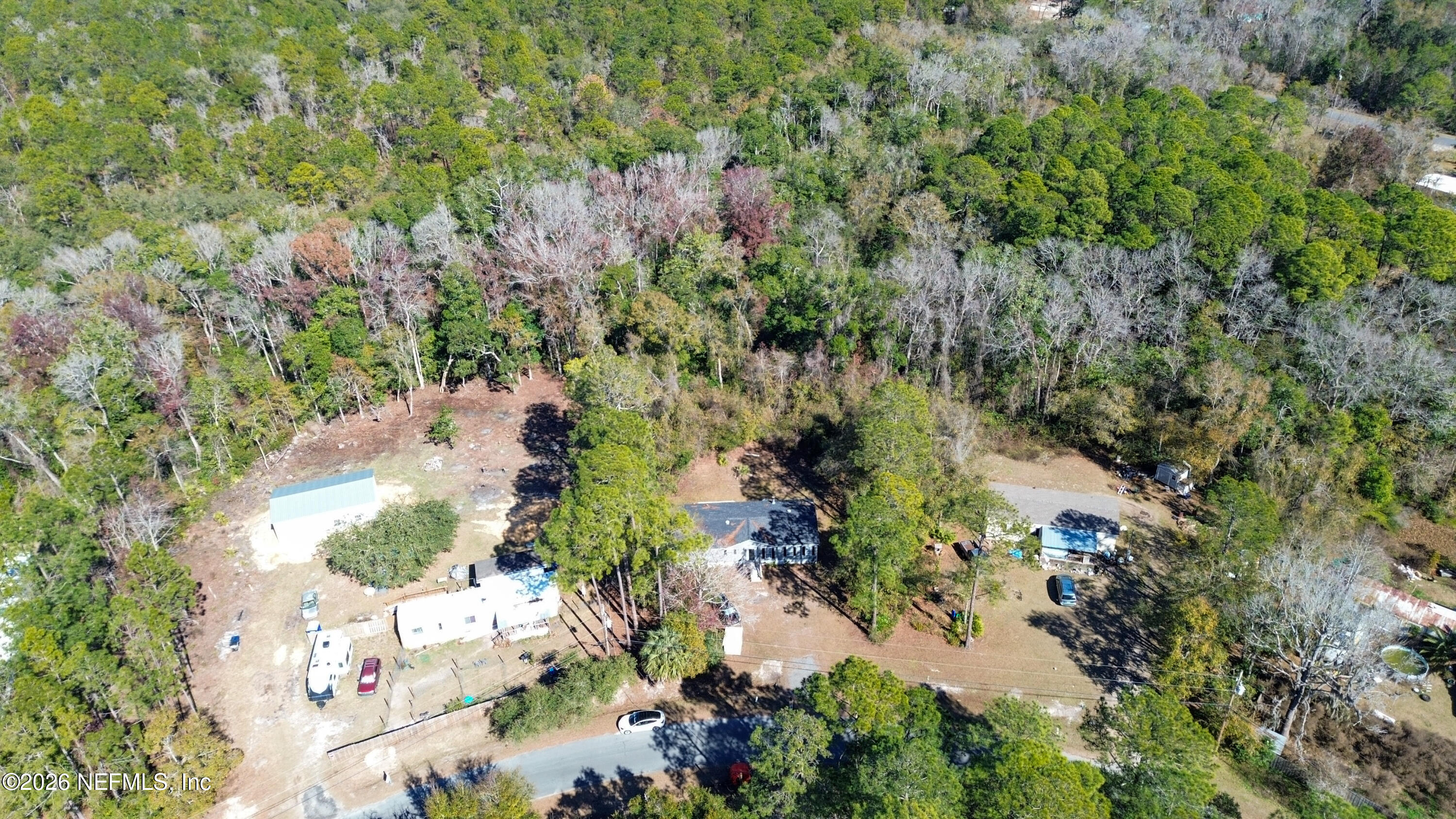 85324 Lil William Road Fernandina Beach, FL 32034 - Photo 36 of 36 an aerial view of residential house with outdoor space and trees all around