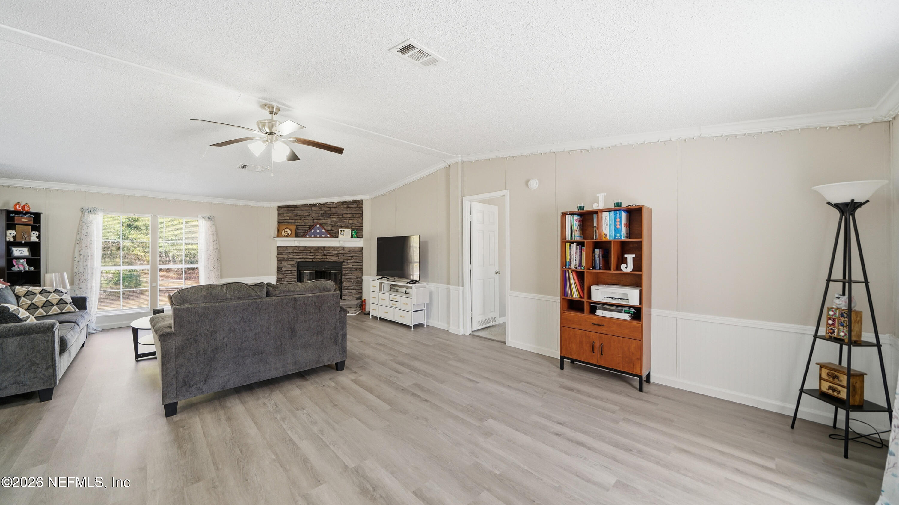 85324 Lil William Road Fernandina Beach, FL 32034 - Photo 6 of 36 a living room with furniture and a fireplace