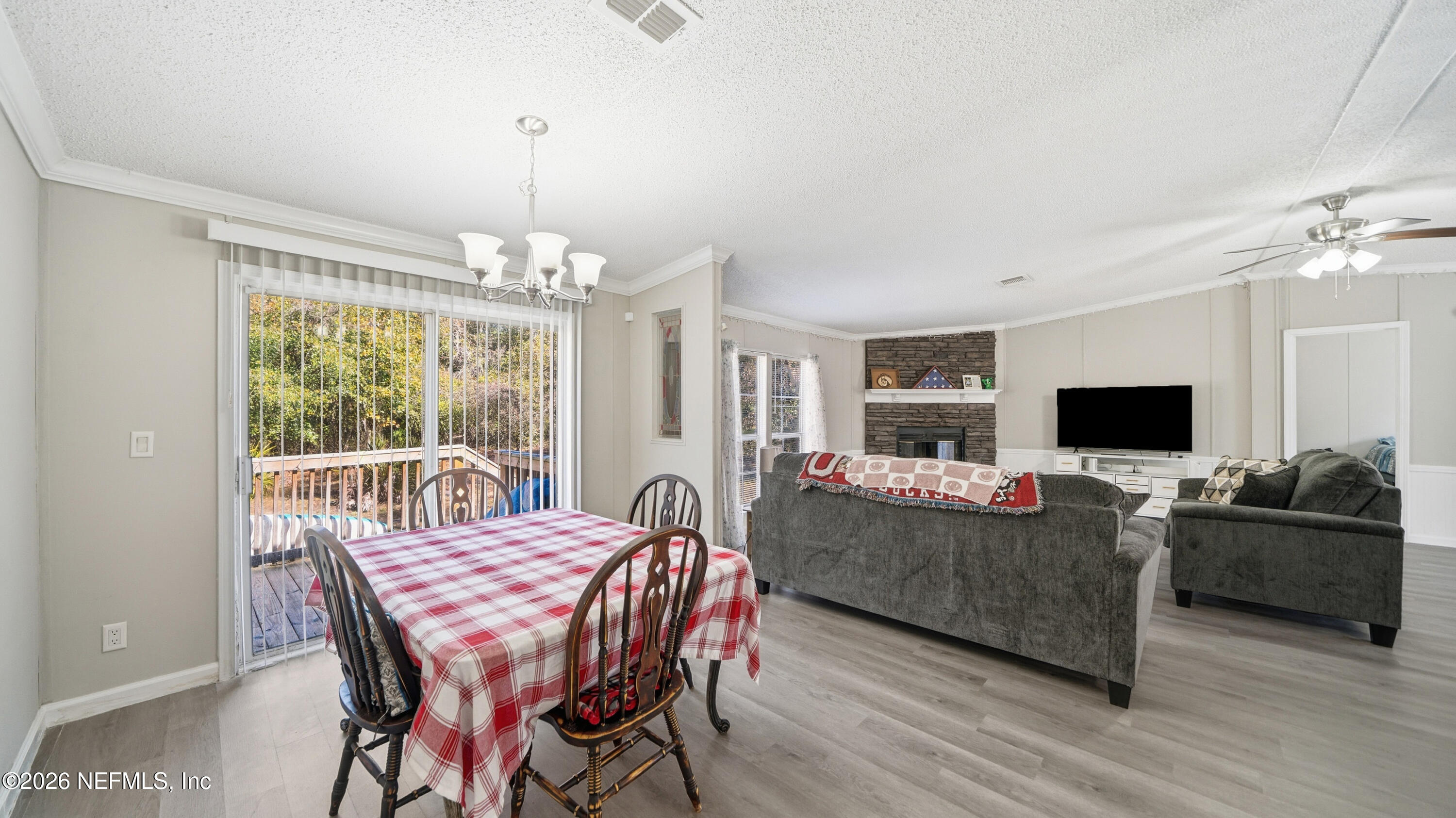 85324 Lil William Road Fernandina Beach, FL 32034 - Photo 9 of 36 a view of a dining room with furniture window and wooden floor
