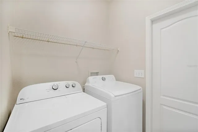 a utility room with dryer and washer