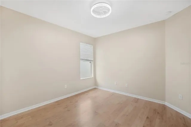 an empty room with a empty space and a window