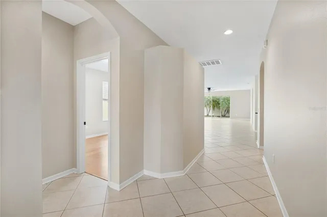 a view of an entryway with wooden floor