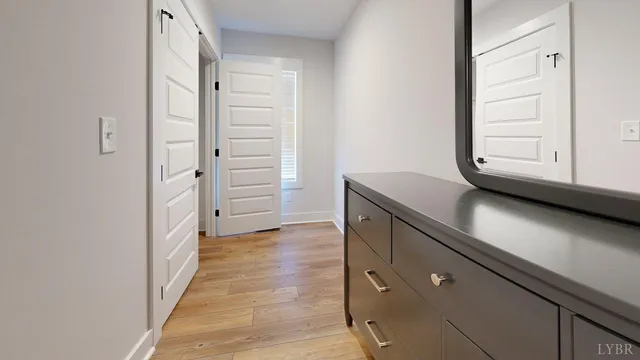 a view of walk in closet with clothes