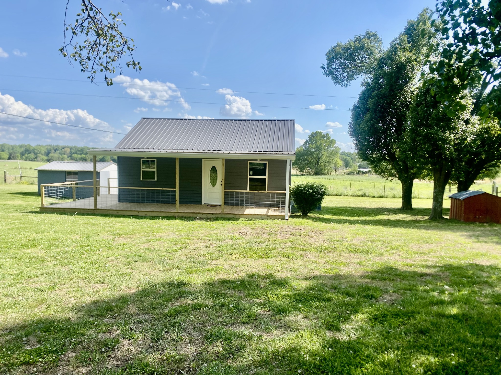 2471 Smartt Station Road Morrison, TN 37357 - Photo 2 of 38 a front view of a house with a garden