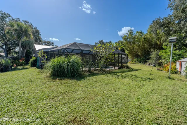 a backyard of a house with lots of green space