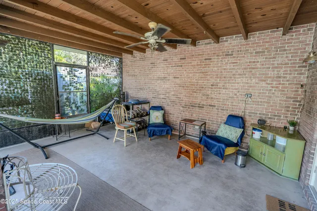 a outdoor living space with furniture and a fireplace