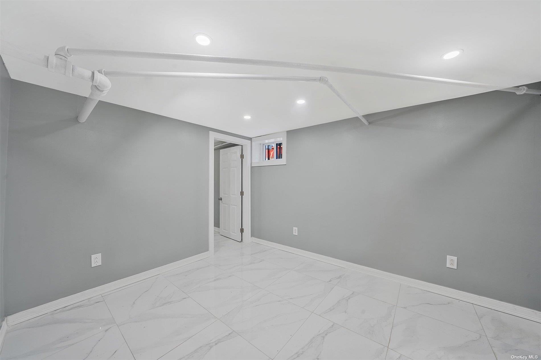 247-14 137th Road Queens, NY 11422 - Photo 19 of 34 an empty room with windows