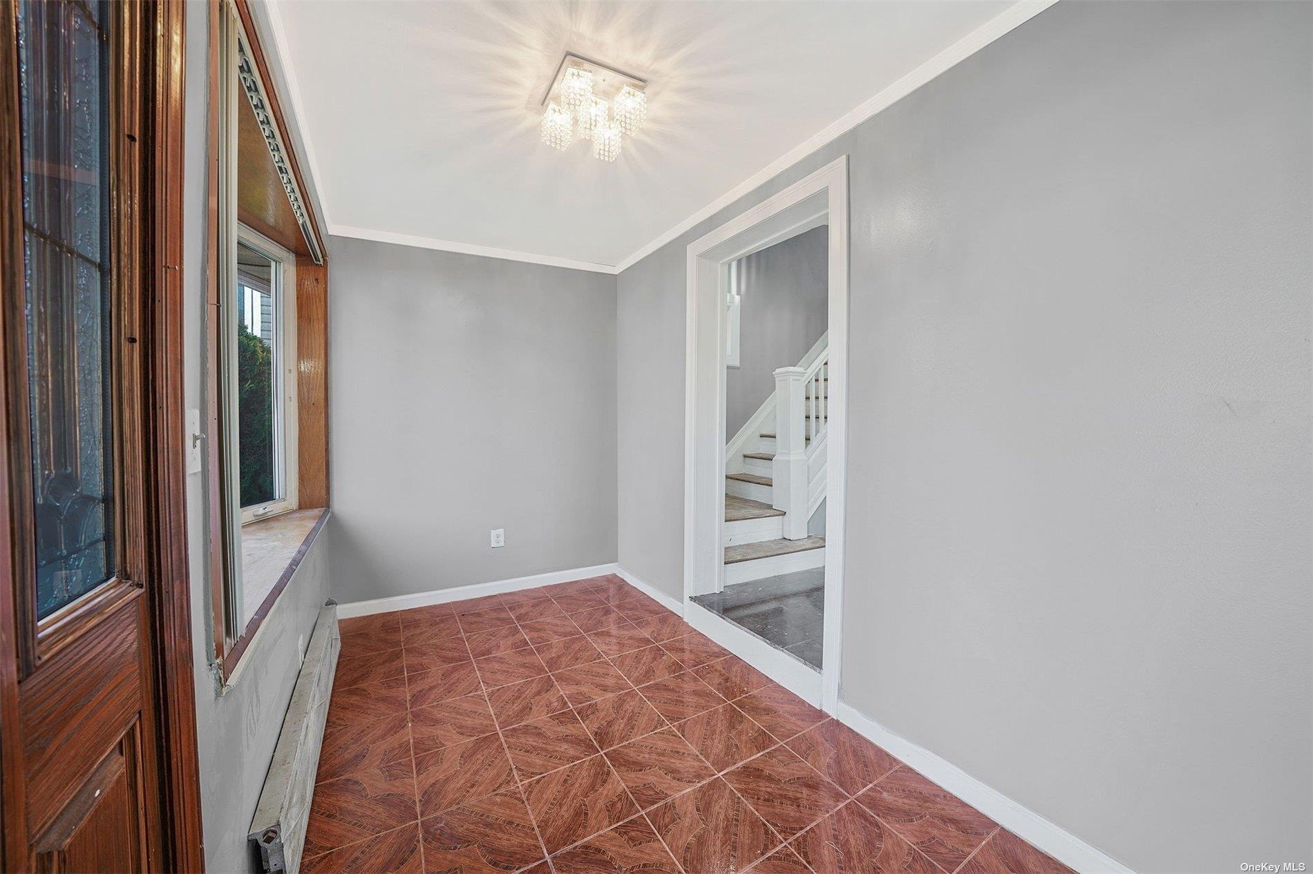 247-14 137th Road Queens, NY 11422 - Photo 27 of 34 wooden floor in an empty room with a window