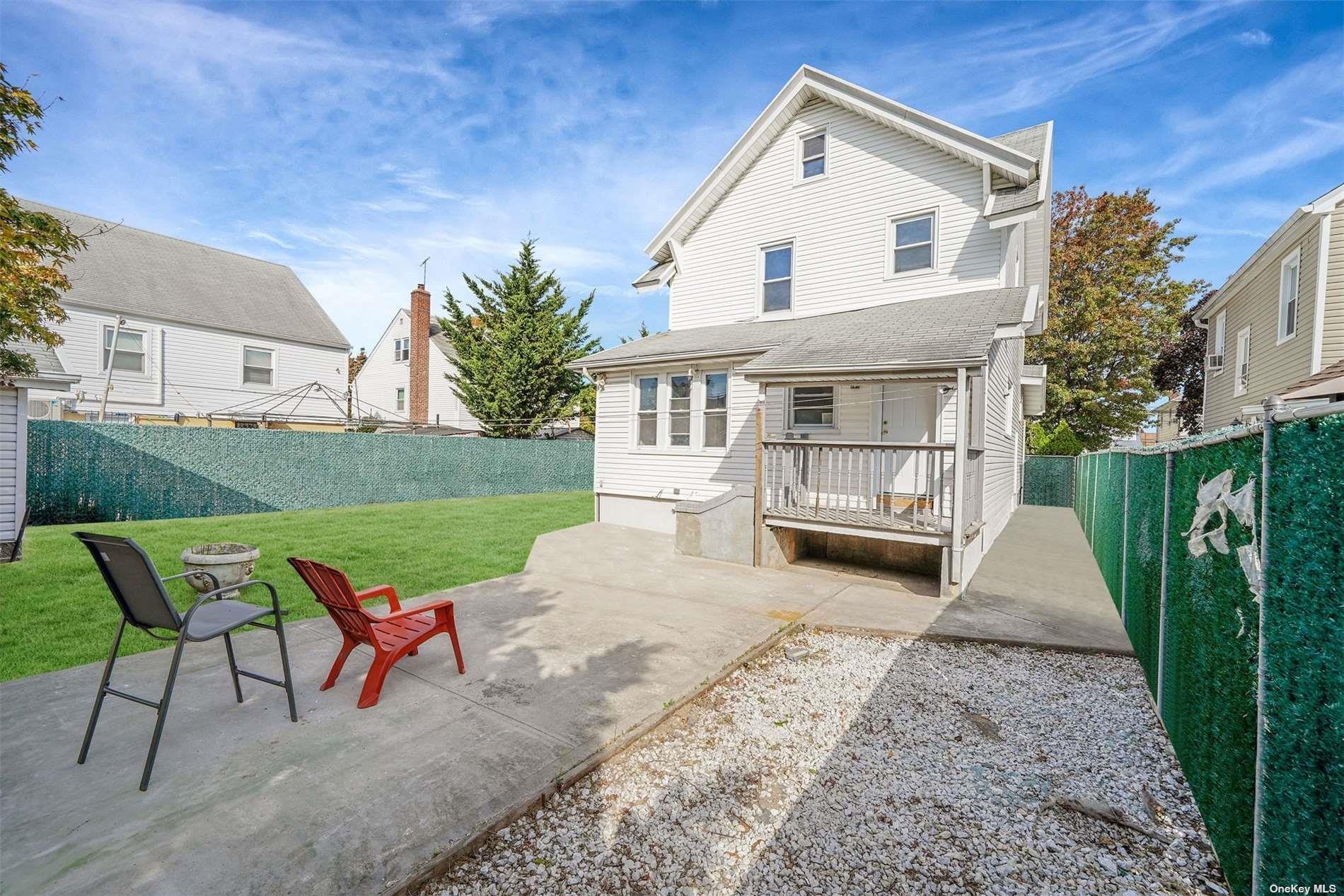 247-14 137th Road Queens, NY 11422 - Photo 31 of 34 a view of a house with backyard and sitting area