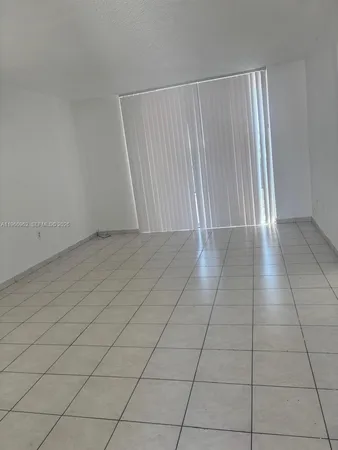 an empty room with a bench