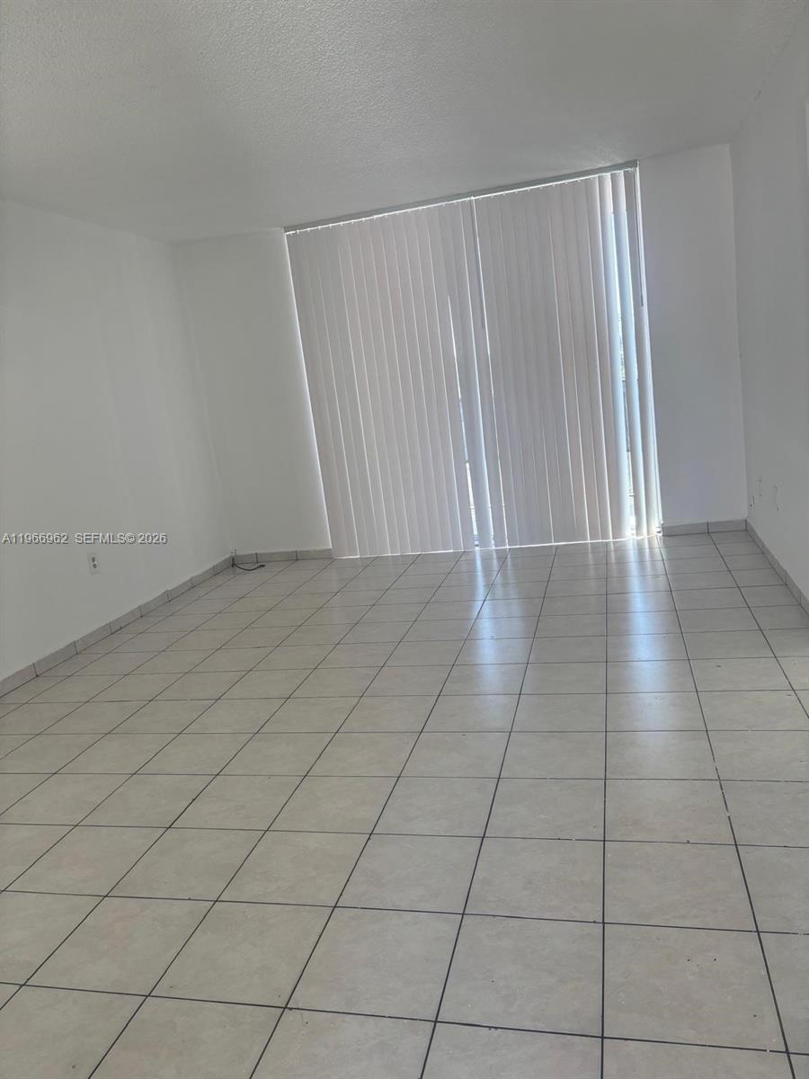 an empty room with a bench