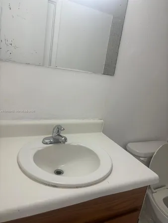 a bathroom with a sink and a toilet