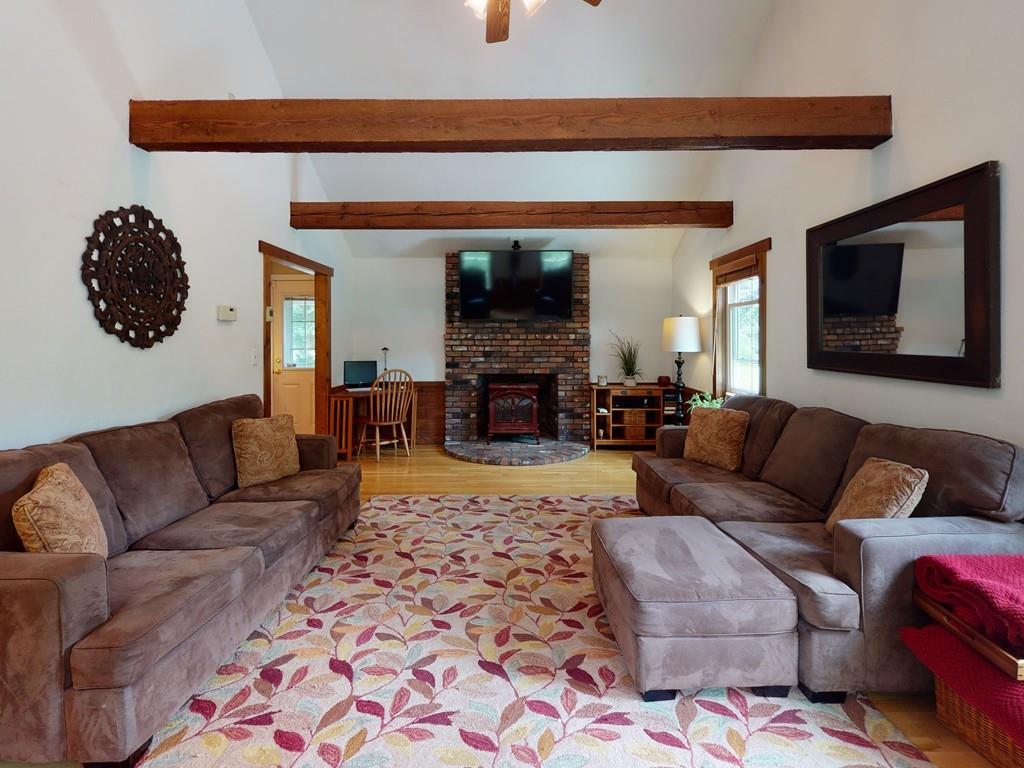 17 Nyra Road Stow, MA 01775 - Photo 13 of 26 a living room with furniture and a fireplace