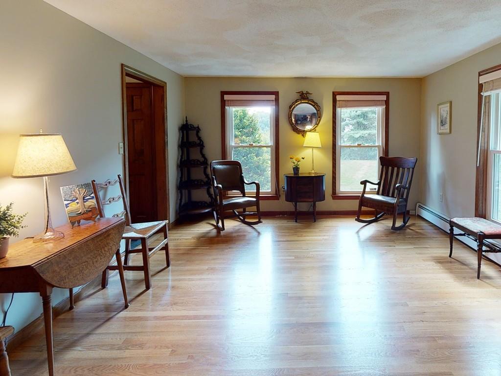 17 Nyra Road Stow, MA 01775 - Photo 14 of 26 a living room with furniture and a lamp