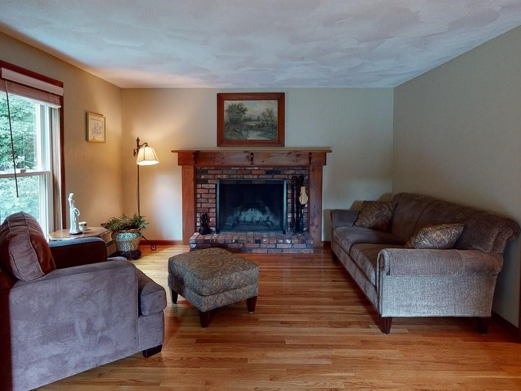 17 Nyra Road Stow, MA 01775 - Photo 16 of 26 a living room with furniture and a fireplace