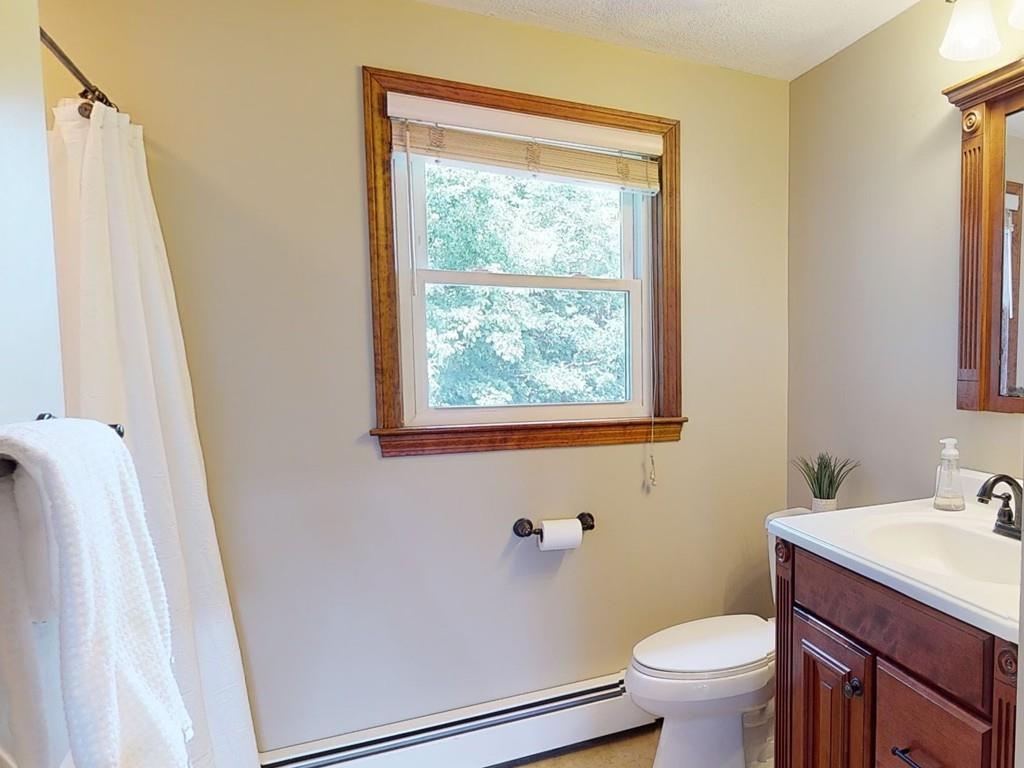 17 Nyra Road Stow, MA 01775 - Photo 23 of 26 a bathroom with a sink and a mirror