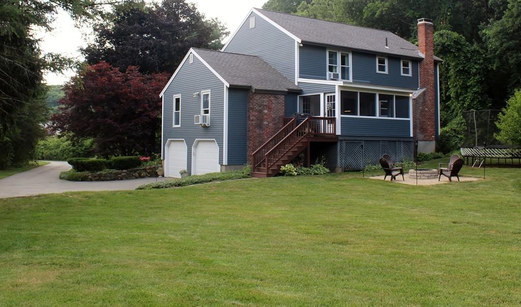 17 Nyra Road Stow, MA 01775 - Photo 4 of 26 a front view of a house with a yard