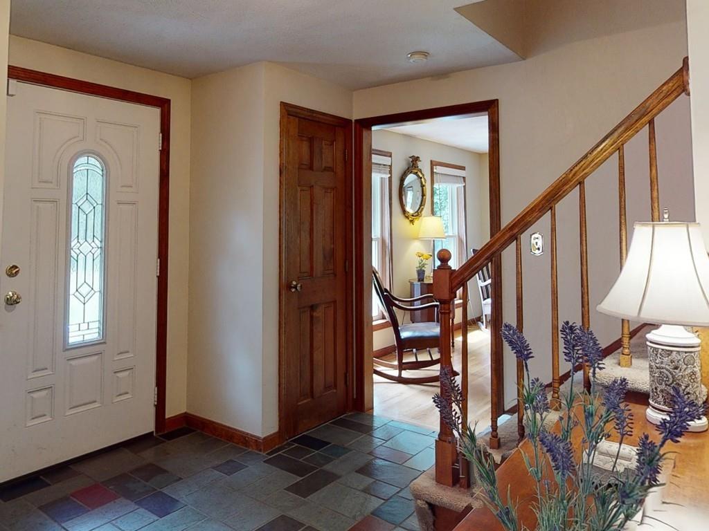 17 Nyra Road Stow, MA 01775 - Photo 5 of 26 a view of an entryway with wooden floor and livingroom