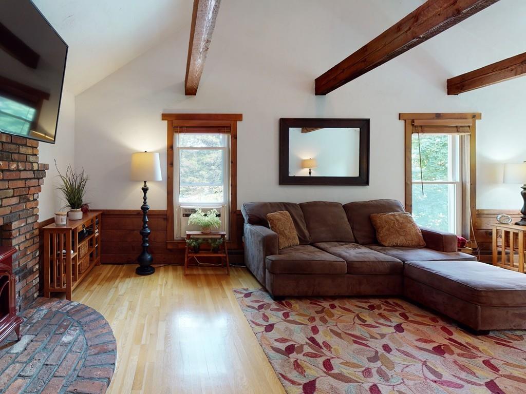 17 Nyra Road Stow, MA 01775 - Photo 10 of 26 a living room with a couch and a window