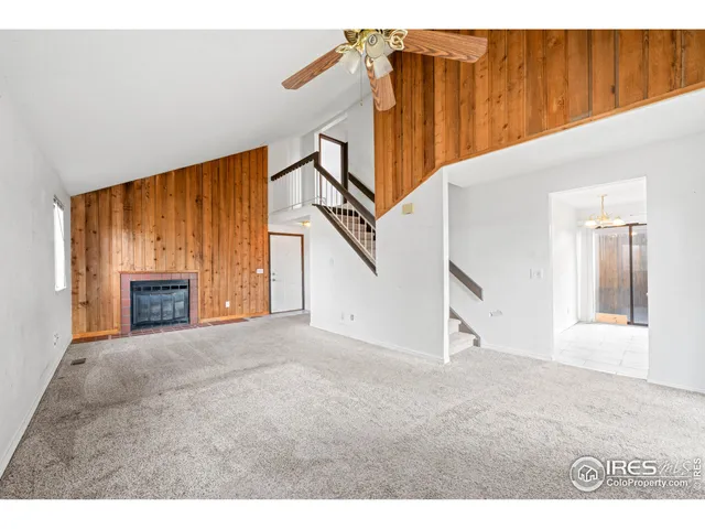 a kitchen with granite countertop a refrigerator and a sink