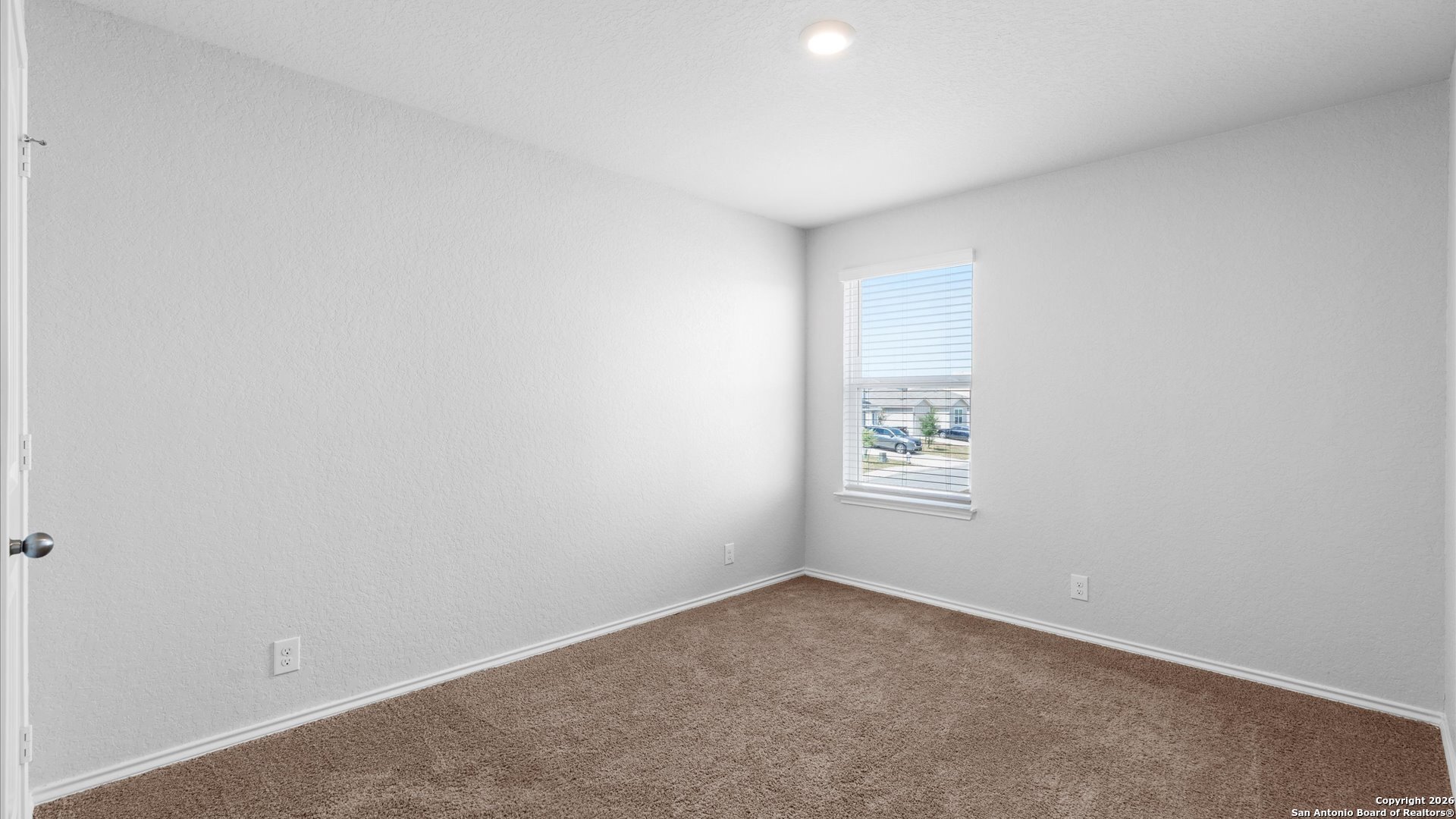 7602 Powder Gorge Converse, TX 78109 - Photo 11 of 17 an empty room with a window