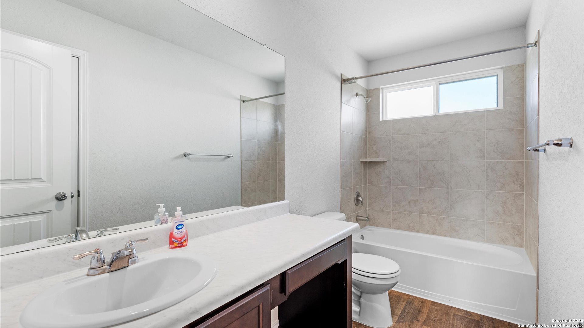 7602 Powder Gorge Converse, TX 78109 - Photo 13 of 17 a bathroom with a sink a toilet and shower