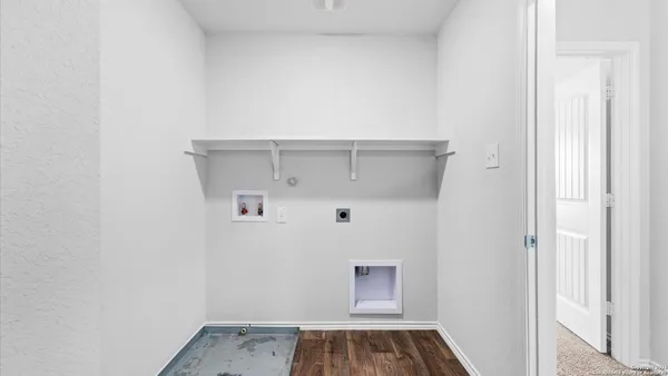 a view of a small space with wooden floor