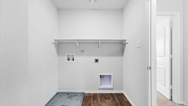 a view of a small space with wooden floor