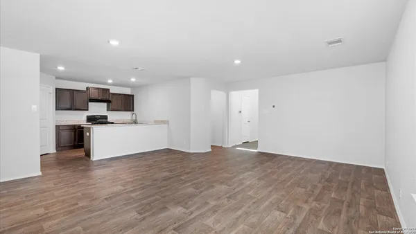 a view of kitchen with microwave and cabinets