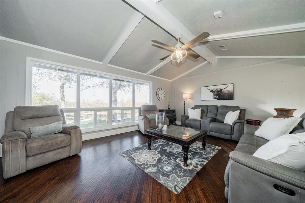 970 North Country Lane Rockwall, TX 75087 - Photo 11 of 40 a living room with furniture and a large window with wooden floor