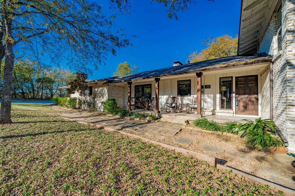 970 North Country Lane Rockwall, TX 75087 - Photo 2 of 40 a view of a house with backyard porch and sitting area