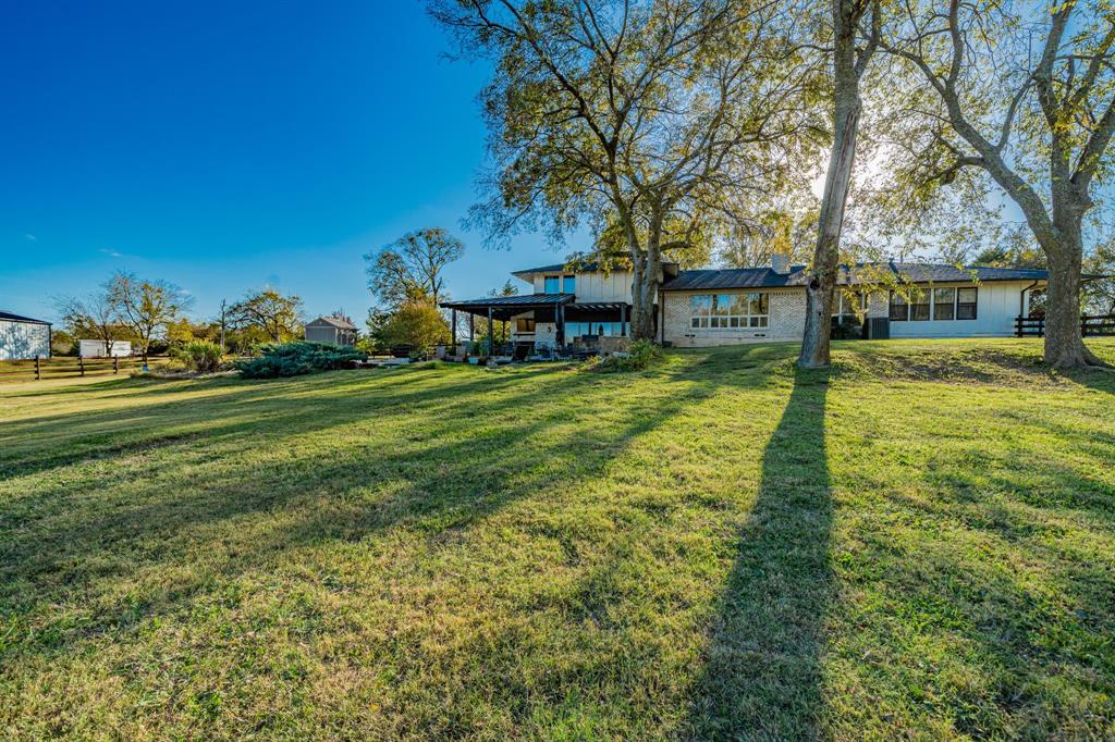 970 North Country Lane Rockwall, TX 75087 - Photo 33 of 40 a view of a house with a yard
