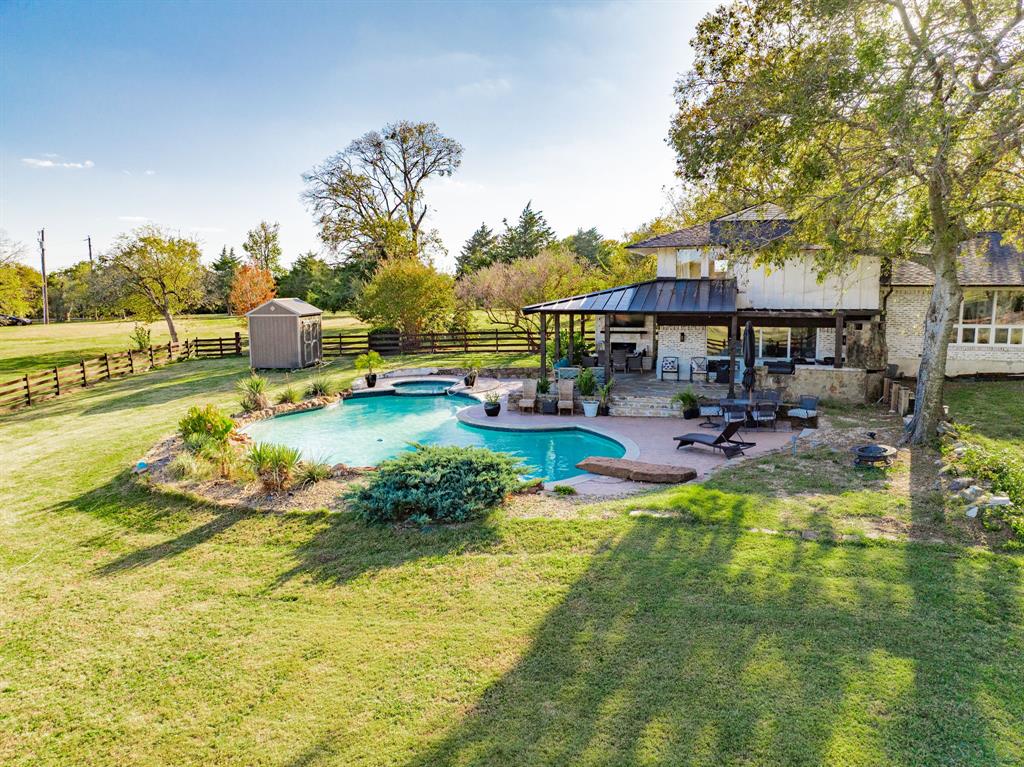 970 North Country Lane Rockwall, TX 75087 - Photo 4 of 40 a swimming pool view with a seating space