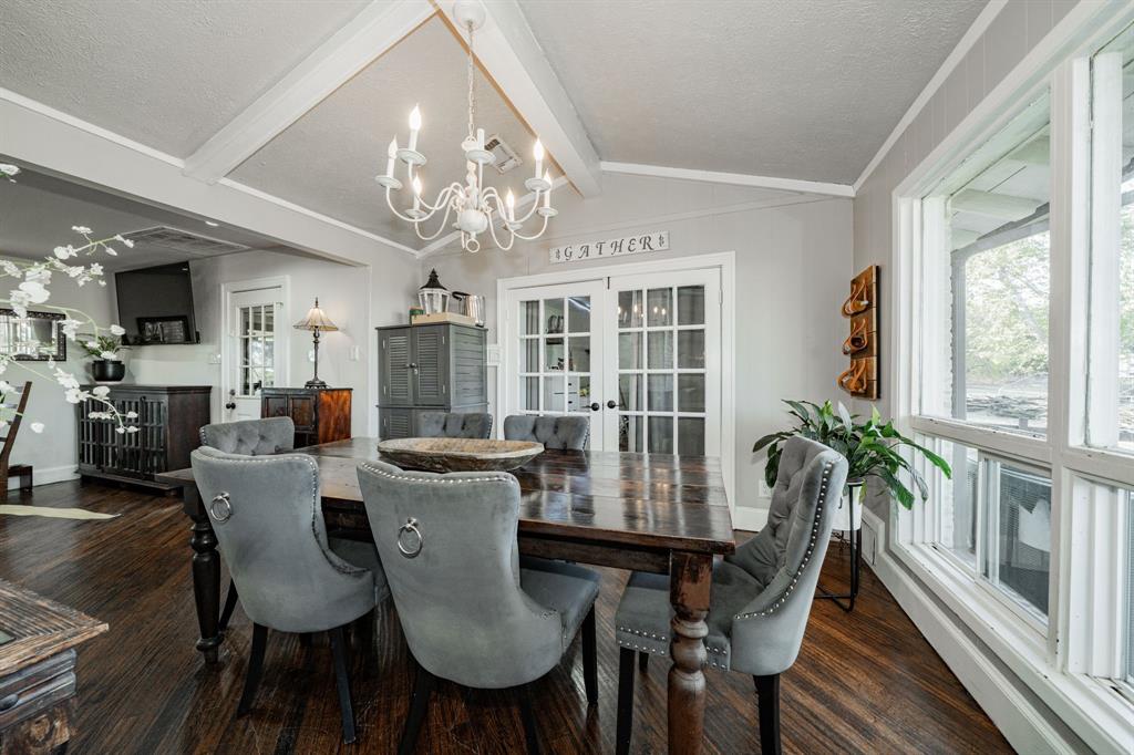 970 North Country Lane Rockwall, TX 75087 - Photo 9 of 40 a view of a dining room with furniture window and wooden floor