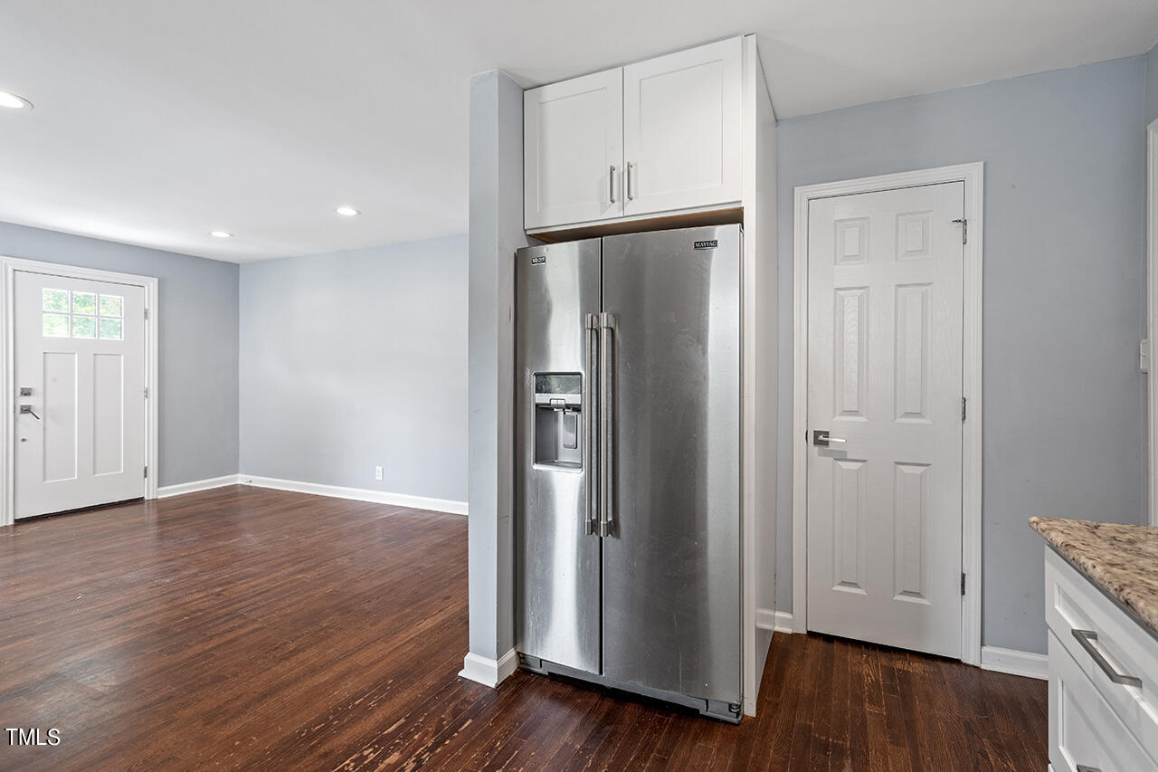 2229 Sheffield Road Raleigh, NC 27610 - Photo 12 of 30 an empty room with wooden floor and closet area