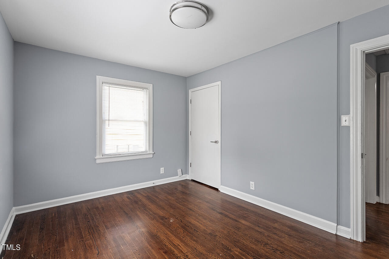 2229 Sheffield Road Raleigh, NC 27610 - Photo 21 of 30 an empty room with wooden floor and windows