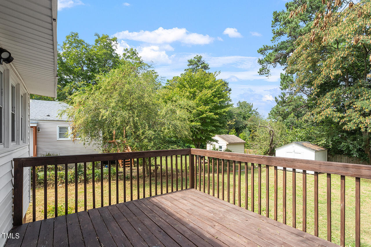 2229 Sheffield Road Raleigh, NC 27610 - Photo 27 of 30 a balcony with wooden floor and fence
