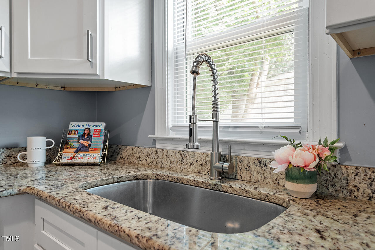 2229 Sheffield Road Raleigh, NC 27610 - Photo 10 of 30 a kitchen with a sink and a window