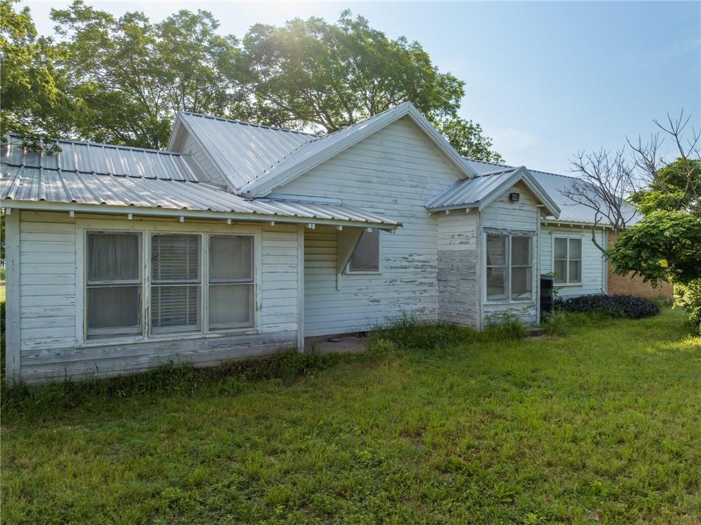 16401 Cedar Rock Parkway Crawford, TX 76638 - Photo 71 of 81 a view of a house with a yard