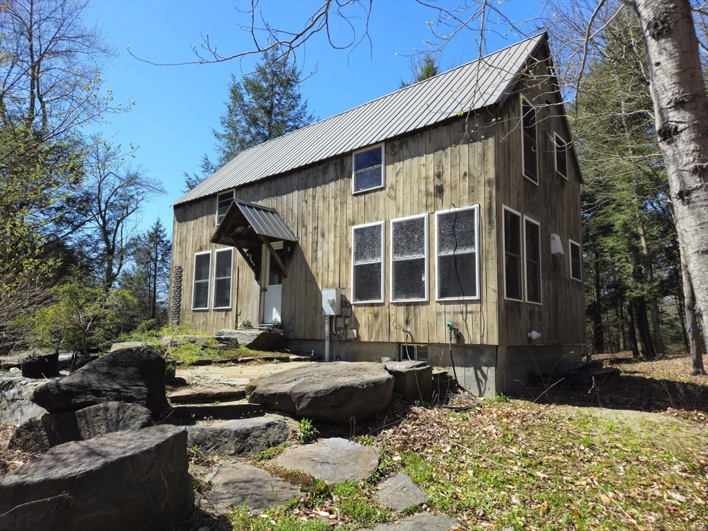 544 Spruce Corner Road Ashfield, MA 01330 - Photo 1 of 32 a view of a house with a yard