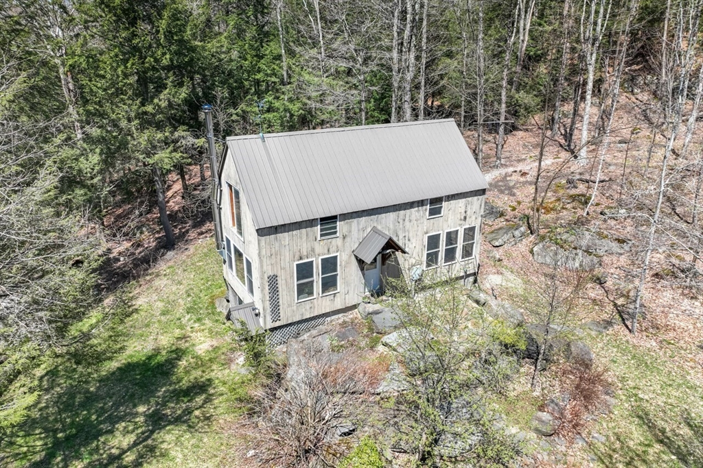544 Spruce Corner Road Ashfield, MA 01330 - Photo 4 of 32 an aerial view of a house with yard and trees in the background
