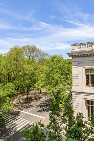 a living room with furniture and large windows