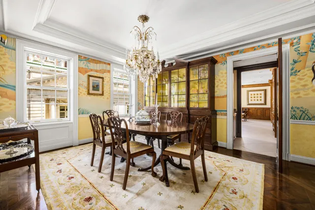 a view of a dining room with furniture wooden floor and chandelier