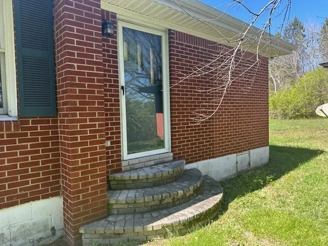 a kitchen with stainless steel appliances granite countertop a refrigerator a stove a sink dishwasher and wooden cabinets