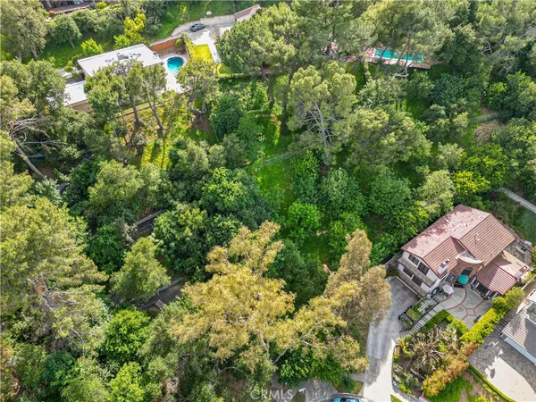an aerial view of a house swimming pool and outdoor space