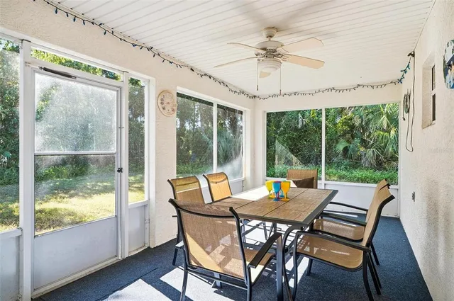 a spacious bedroom with a bed and a chandelier