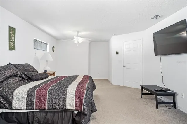 a bedroom with furniture and a chandelier