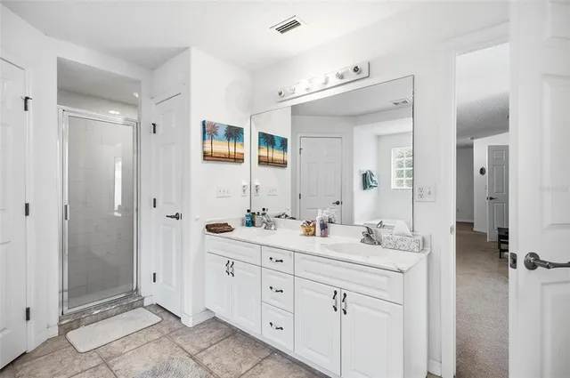 a white toilet sitting next to a shower