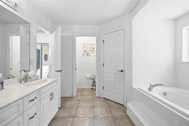 a bath tub sitting next to a window